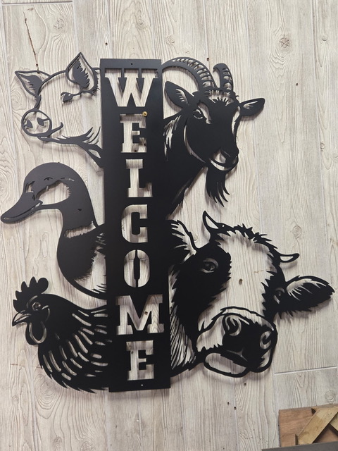Metal welcome sign with farm animals.jpeg